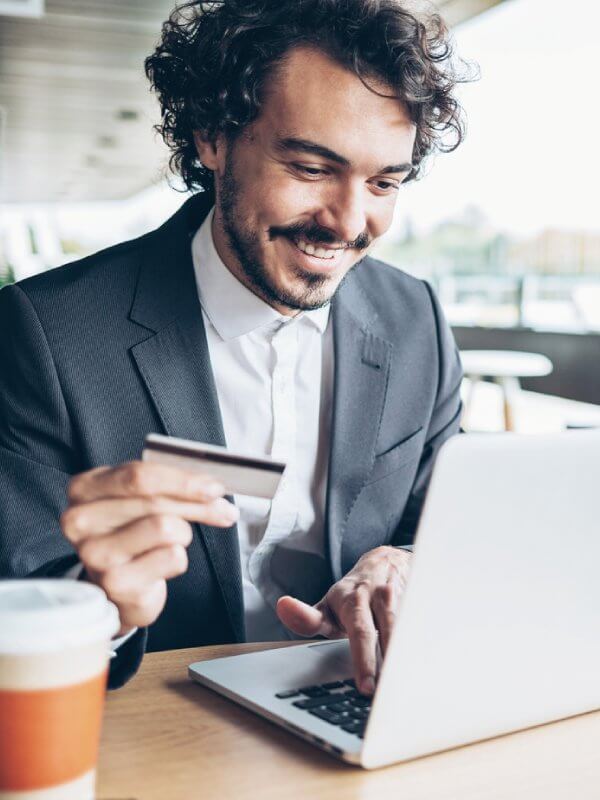 Man using his laptop to purchase