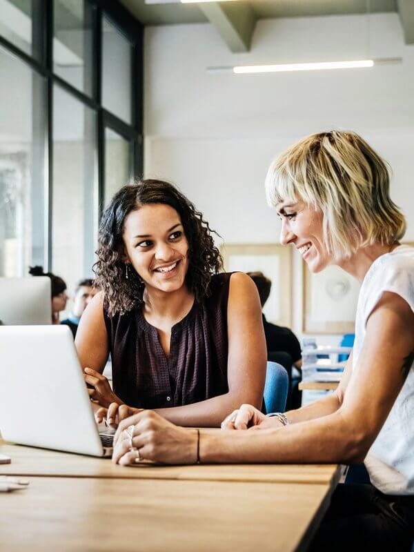 Two colleagues talking in an office