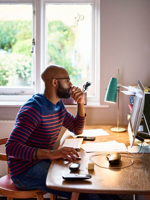 Man at home applying for credit