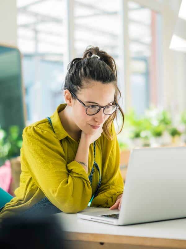 Employee looking at data on a laptop