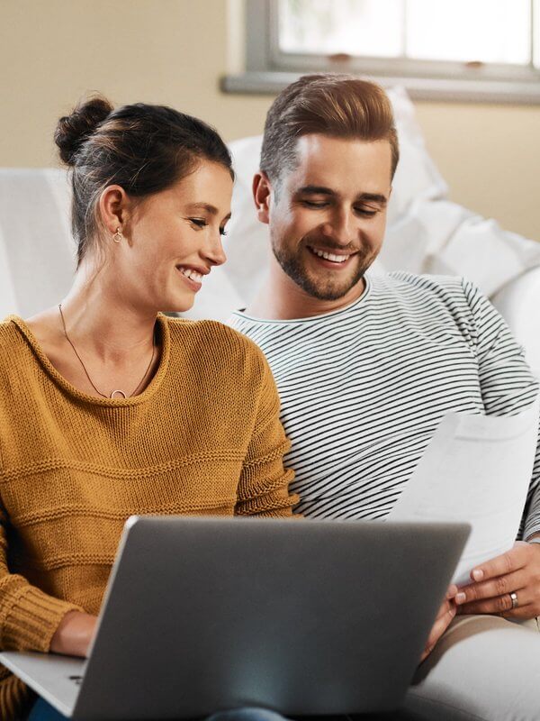 Young couple verifying documents online