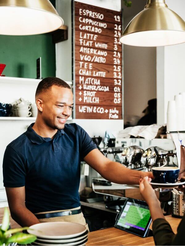 Small business owner serving a customer