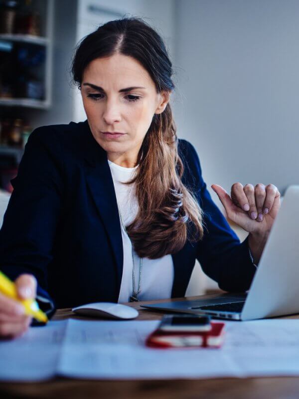 Woman in an office assessing her credit risk strategy