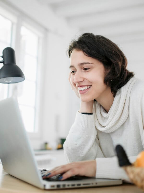 Woman smiling while making purchases online