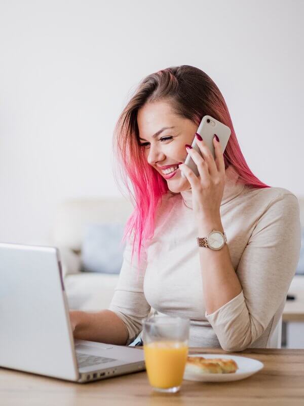 Woman working from home at breakfast