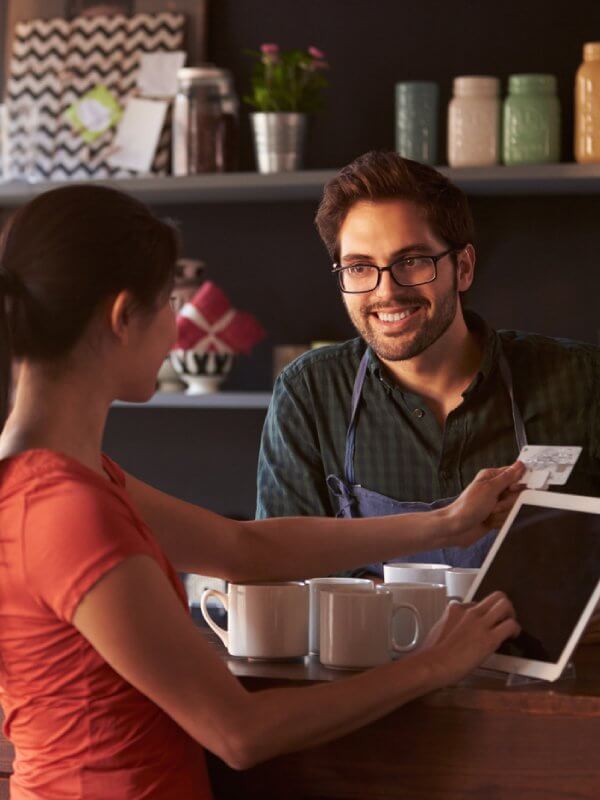 Business owner talking to his customer