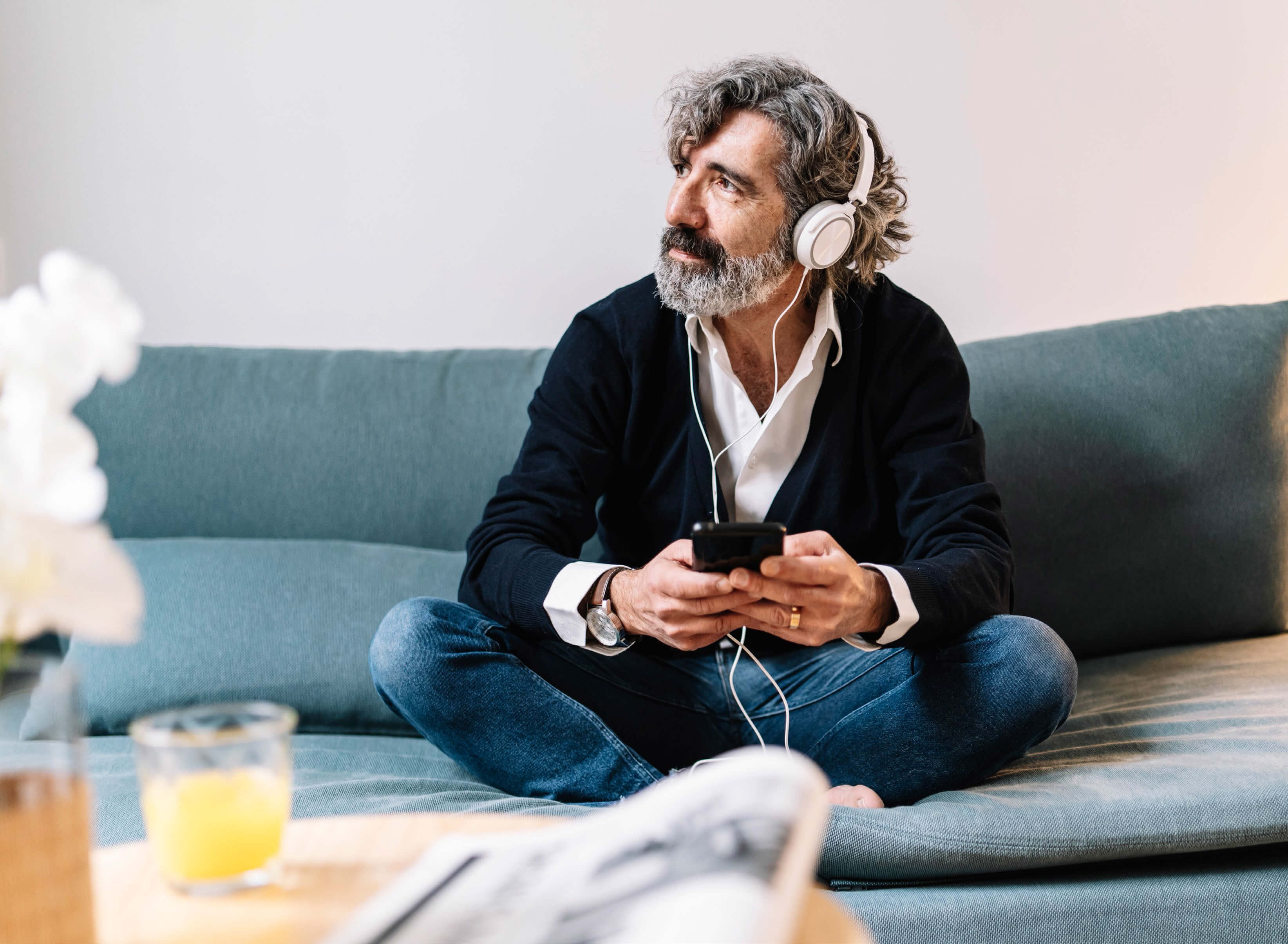 man listening to smartphone with headphones